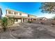 Expansive backyard with covered patio, offering great potential for outdoor living and entertaining space at 22500 N Greenland Park Dr, Maricopa, AZ 85139