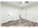 Bright bedroom with modern floors and neutral walls offers a versatile living space at 22500 N Greenland Park Dr, Maricopa, AZ 85139