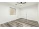 This bedroom offers a closet, modern floors, and natural light for a comfortable living space at 22500 N Greenland Park Dr, Maricopa, AZ 85139
