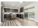 Stylish kitchen with stainless steel appliances, center island and sliding glass doors at 22500 N Greenland Park Dr, Maricopa, AZ 85139