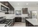View of the kitchen with stainless steel appliances and a large countertop at 22500 N Greenland Park Dr, Maricopa, AZ 85139