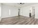 This spacious main bedroom offers a ceiling fan, modern flooring and great natural light at 22500 N Greenland Park Dr, Maricopa, AZ 85139