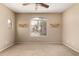 Bright and airy bedroom with neutral walls, a ceiling fan, and natural light at 2600 E Springfield Pl # 61, Chandler, AZ 85286