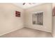 Clean bedroom space featuring neutral walls, carpeting and an ample source of natural light at 2600 E Springfield Pl # 61, Chandler, AZ 85286