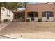Back of house with covered patio, tile roof and green landscaping at 2600 E Springfield Pl # 61, Chandler, AZ 85286