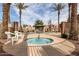 Community pool and hot tub framed by palm trees and decorative fencing at 2600 E Springfield Pl # 61, Chandler, AZ 85286
