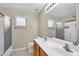 Bathroom showcasing dual sinks, modern fixtures, and a shower and tub combo at 2662 S Iowa St, Chandler, AZ 85286