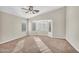Empty bedroom with neutral carpet, large windows and a vaulted ceiling at 2662 S Iowa St, Chandler, AZ 85286