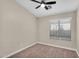 Cozy bedroom featuring neutral walls, carpeted floors, and a window for natural light at 2662 S Iowa St, Chandler, AZ 85286