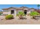 Charming single-story home with desert landscaping, stone accents, and a well-manicured lawn at 2662 S Iowa St, Chandler, AZ 85286