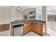 Corner view of an efficient kitchen with stainless appliances and granite counters at 2662 S Iowa St, Chandler, AZ 85286