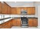 Well appointed kitchen featuring stainless appliances and lots of cabinet space at 2662 S Iowa St, Chandler, AZ 85286