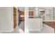 Bright kitchen with stainless appliances and tile flooring open to dining area at 2662 S Iowa St, Chandler, AZ 85286