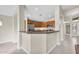 Gourmet kitchen with granite countertops, stainless steel appliances, and breakfast bar at 2662 S Iowa St, Chandler, AZ 85286