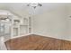 Large living room with hardwood floors, high ceilings, and decorative alcoves at 2662 S Iowa St, Chandler, AZ 85286