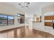 Open concept living room featuring hardwood floors, large windows and vaulted ceilings at 2662 S Iowa St, Chandler, AZ 85286