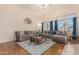Spacious living room with vaulted ceilings, hardwood floors, and comfortable seating at 2662 S Iowa St, Chandler, AZ 85286