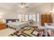 Spacious primary bedroom featuring a ceiling fan, large window and vaulted ceilings at 2662 S Iowa St, Chandler, AZ 85286