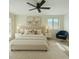 Comfortable bedroom with neutral tones, plush carpet, and a stylish accent chair at 307 W Alamo Dr, Chandler, AZ 85225