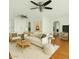 Bright living room featuring hardwood floors, neutral paint, and modern ceiling fans at 307 W Alamo Dr, Chandler, AZ 85225