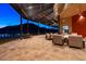 Relaxing outdoor patio with fire pit and seating, overlooking a pool and mountain view at 32553 N 133Rd Ave, Peoria, AZ 85383