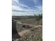 Picturesque walking path winding through a desert landscape with native vegetation and clear blue skies in the background at 32553 N 133Rd Ave, Peoria, AZ 85383