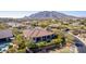 Aerial view of a well-maintained home featuring a pool and lush landscaping at 37267 Ne Greythorn Cir, Carefree, AZ 85377