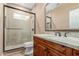 Bathroom features granite counters, wood cabinets, decorative tile in shower at 37267 Ne Greythorn Cir, Carefree, AZ 85377
