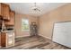Well-lit dining area with decorative chandelier, wood floors, and modern decor at 37267 Ne Greythorn Cir, Carefree, AZ 85377