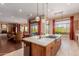 Spacious kitchen island featuring a stovetop and sink at 37267 Ne Greythorn Cir, Carefree, AZ 85377