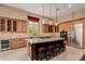 Gourmet kitchen with an island, stainless steel appliances, and custom cabinetry at 37267 Ne Greythorn Cir, Carefree, AZ 85377