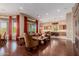 Open concept living room and kitchen with hardwood floors and large windows at 37267 Ne Greythorn Cir, Carefree, AZ 85377
