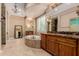 Luxurious primary bathroom with a large tub and dual vanities at 37267 Ne Greythorn Cir, Carefree, AZ 85377