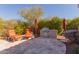 Outdoor kitchen featuring a stainless steel grill, counterspace and lounge chairs at 37267 Ne Greythorn Cir, Carefree, AZ 85377