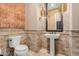 Charming powder room featuring unique fixtures and decorative tiles at 37267 Ne Greythorn Cir, Carefree, AZ 85377