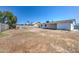 Expansive backyard featuring a block fence and a covered patio, perfect for entertaining or relaxing at 3728 E Grove Ave, Mesa, AZ 85206