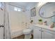 Bathroom with shower and tub combo, and updated vanity with decorative items adds charm at 3728 E Grove Ave, Mesa, AZ 85206