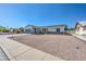 Well-kept single-story home with gravel landscaping, stone accents, and an attached garage on a sunny day at 3728 E Grove Ave, Mesa, AZ 85206