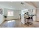 Spacious kitchen featuring a central island with bar stools, modern appliances, and plenty of natural light at 3728 E Grove Ave, Mesa, AZ 85206