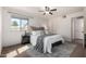 Bright bedroom features natural light, a ceiling fan, and dark furniture at 4354 N 82Nd St # 183, Scottsdale, AZ 85251