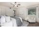 Cozy bedroom features natural light, a ceiling fan and neutral decor at 4354 N 82Nd St # 183, Scottsdale, AZ 85251