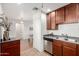 Well-lit kitchen features stainless steel appliances and wooden cabinets at 4354 N 82Nd St # 183, Scottsdale, AZ 85251