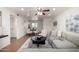 Bright living area connected to the dining room, showcasing a comfortable gray sectional and stylish decor at 4354 N 82Nd St # 183, Scottsdale, AZ 85251