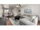 Comfortable living room flows into dining area, featuring gray sectional sofa and neutral tones for a serene ambiance at 4354 N 82Nd St # 183, Scottsdale, AZ 85251