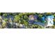 Aerial view showcasing a luxurious estate with a private pool, manicured grounds, and tile roof at 5710 E Camelback Rd, Phoenix, AZ 85018