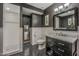 Modern bathroom featuring a walk-in shower, black and white tile, and updated fixtures at 5710 E Camelback Rd, Phoenix, AZ 85018
