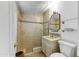 Bathroom with decorative tile work, a sink vanity, and a toilet at 5710 E Camelback Rd, Phoenix, AZ 85018