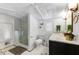 Stylish bathroom features a glass shower, white subway tile, and a striking black and white mosaic floor at 5710 E Camelback Rd, Phoenix, AZ 85018