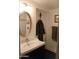 Modern bathroom featuring updated vanity, sleek fixtures, and tiled shower at 5710 E Camelback Rd, Phoenix, AZ 85018