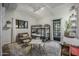 Brightly lit bedroom with a cozy area, bunkbeds, and neutral carpet at 5710 E Camelback Rd, Phoenix, AZ 85018